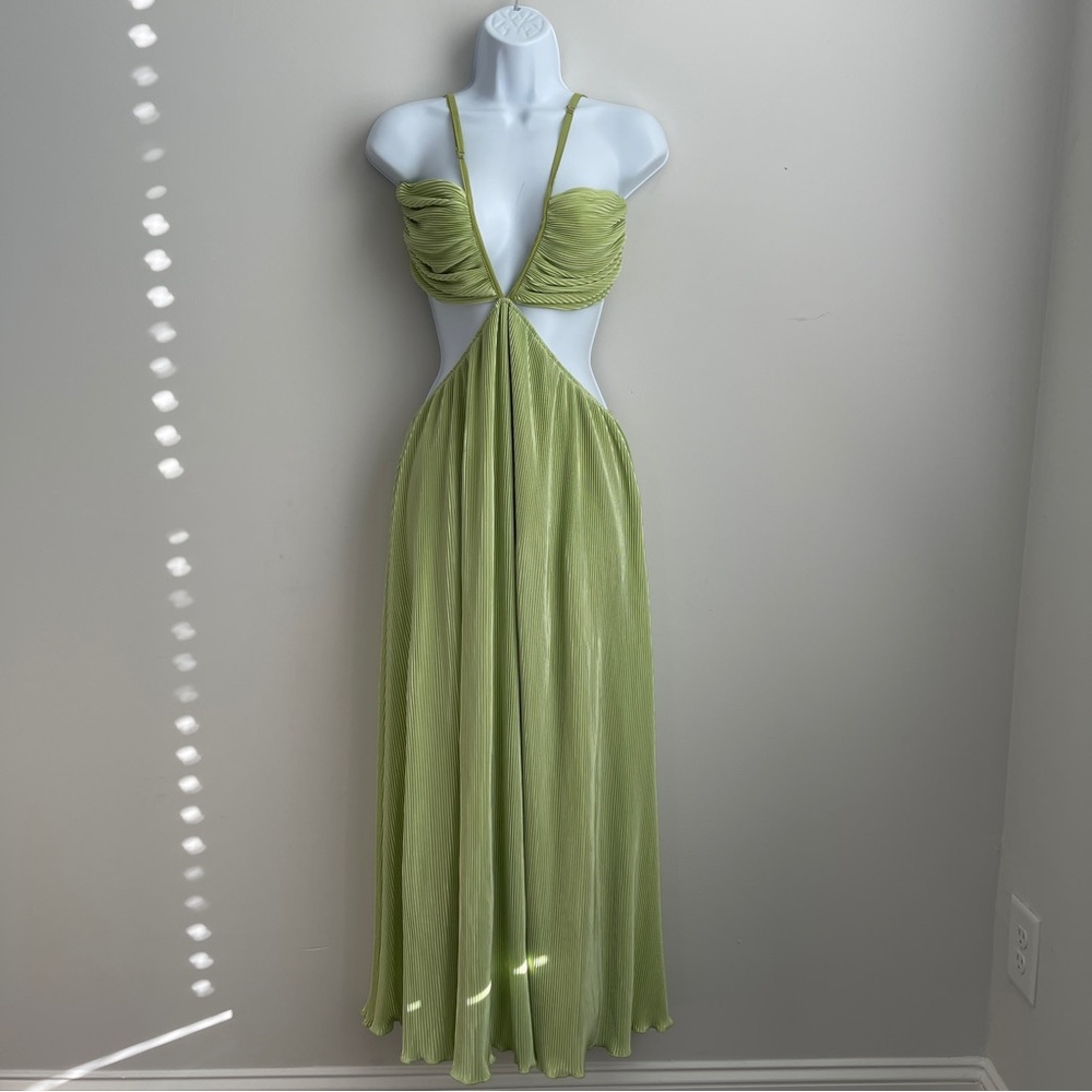 Olia pleated maxi dress with cutouts on the sides and a plunging V-neckline.
